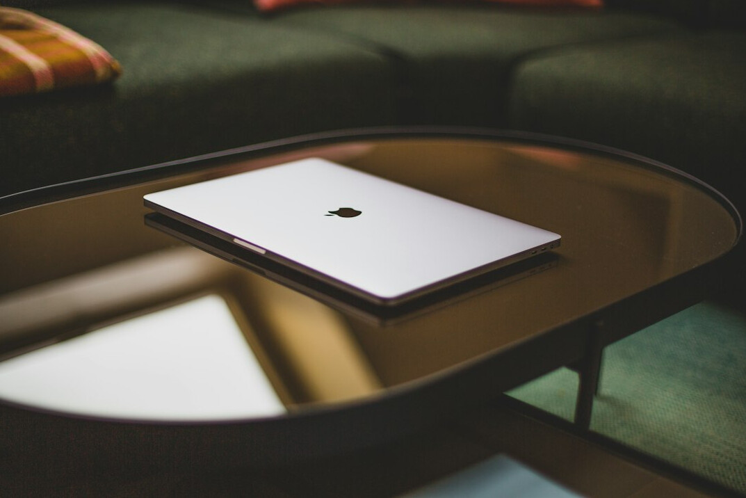 Laptop and notebook on a desk